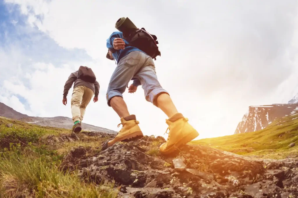 Two tourists are going up at sunset time in the mountains area in Salt Lake City, UT | Santosh Yoga Institute